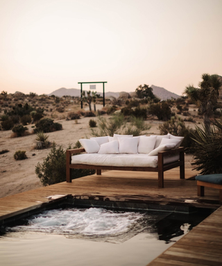 couch on a deck in the desert
