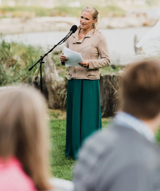 person at a microphone telling a story