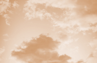 clouds in the sky with a tan color filter